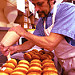 Bill Wilson Jr. fills the jelly cream donuts at Donna's Donuts
