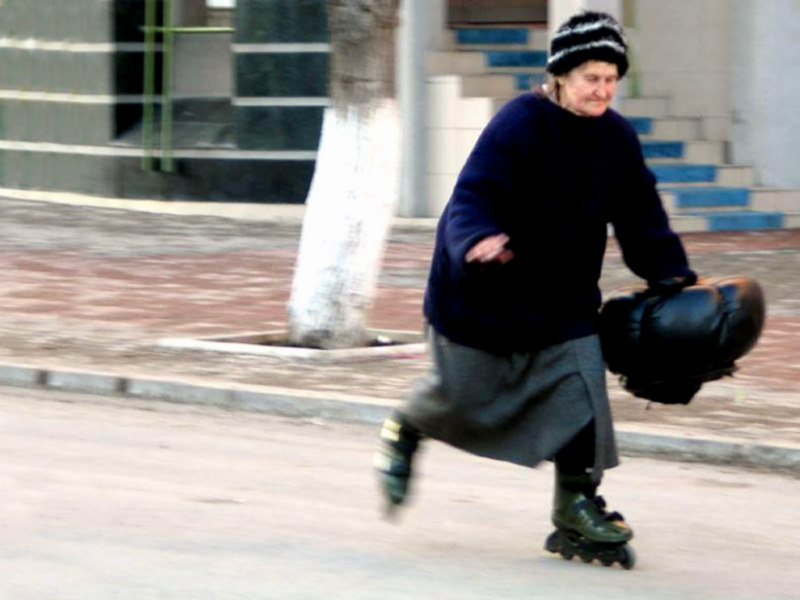 elderly woman on rollerblades; grandma on rollerblades; who knows if it's real?